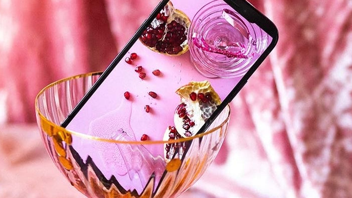 Phone in a champaign glass