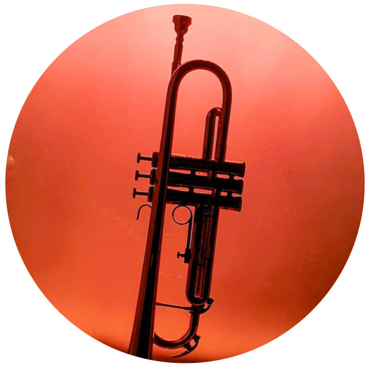 Trumpet silhouette against a red background