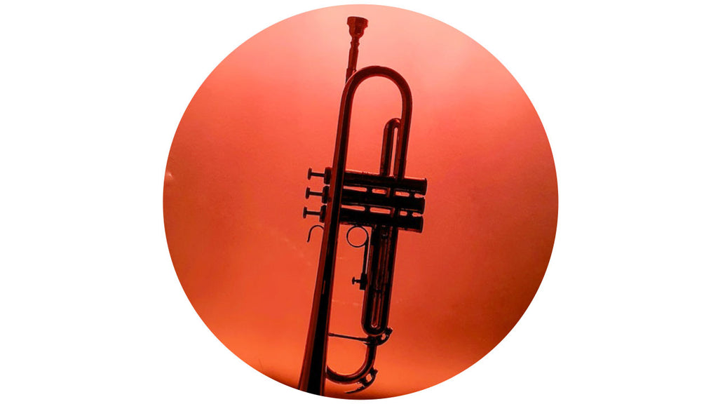 Trumpet silhouette against a red background