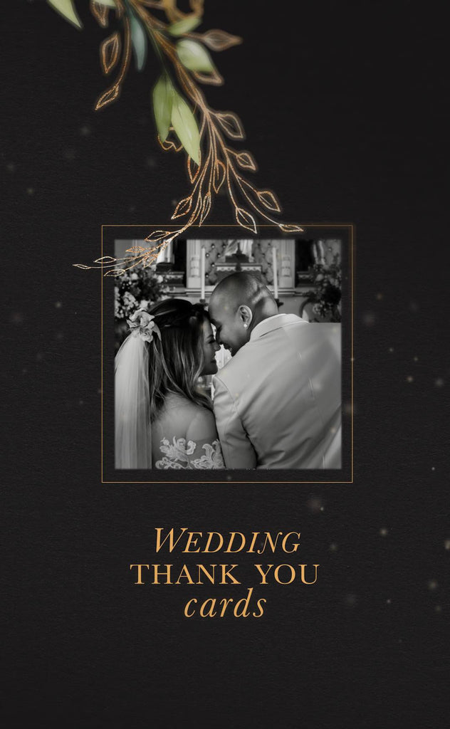 Black card with gold and green foliage over the top of a black and white photo of couple getting married. Underneath is the text written Wedding thank you cards
