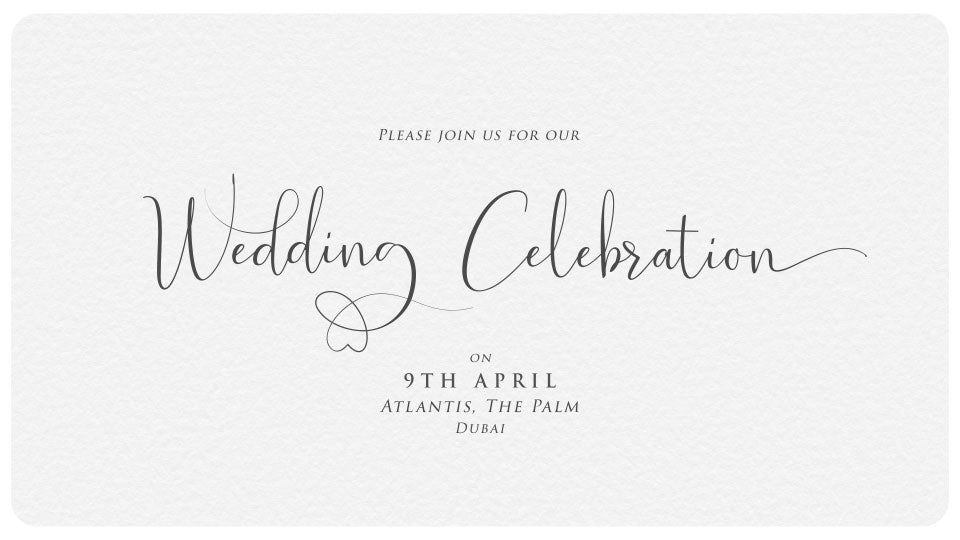 Cursive Wedding Font on white paper writing the words Wedding Celebration