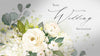 White wedding invitation with flowers and calligraphy text. 