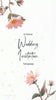  Pink flowers surround wedding invitation information. 